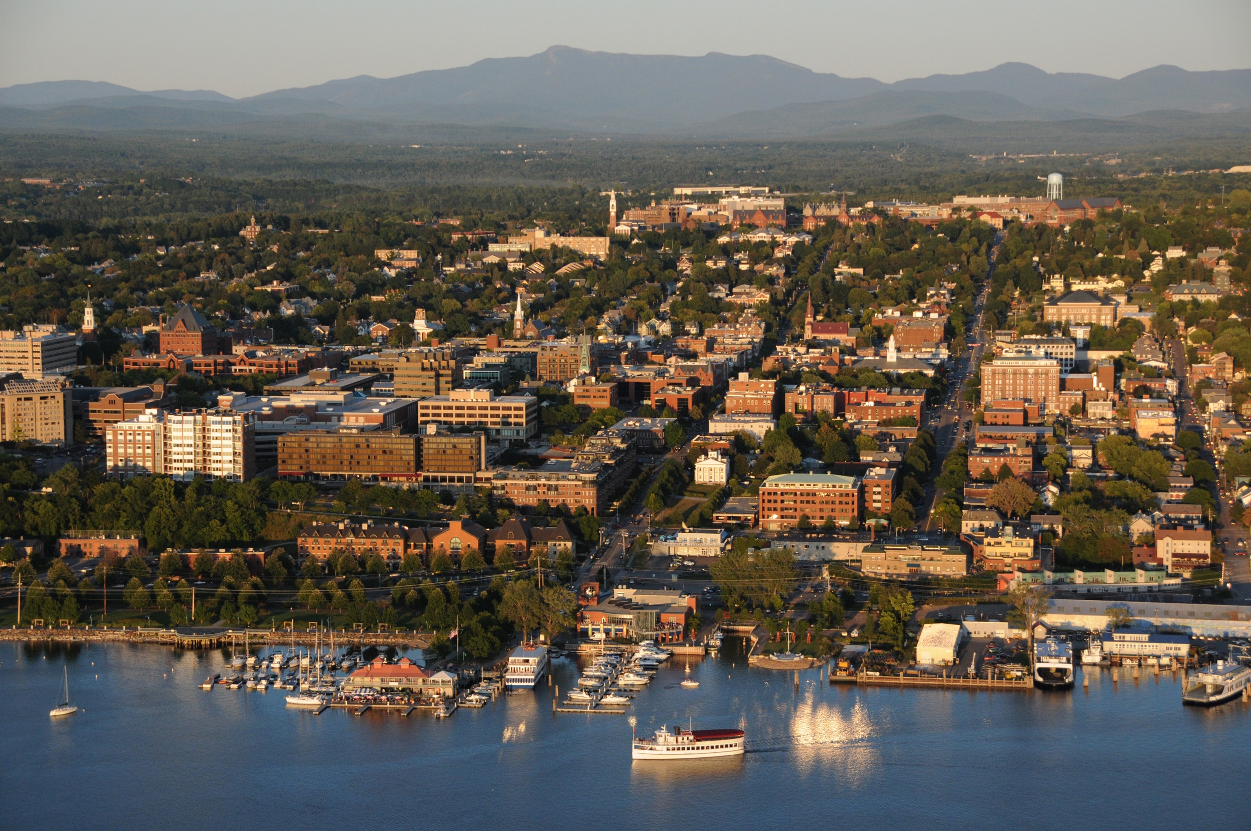 Sunset light over Burlington, Vermont waterfront on Lake Champlain with the University of Vermont and Mt. Mansfield.